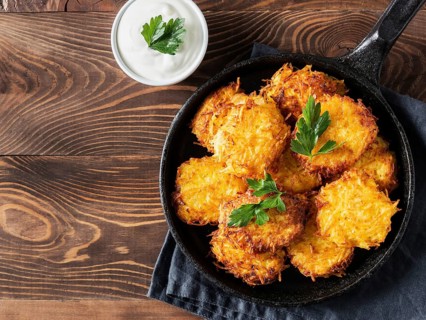 Potatoes pancakes latkes, flapjacks, hash brown or potato vada with white greek yoghurt or sour