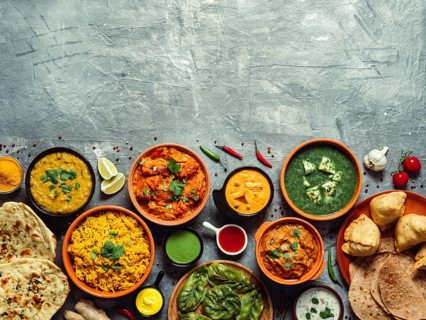 Indian cuisine dishes: tikka masala, dal, paneer, samosa, chapati, chutney, spices. Indian food on