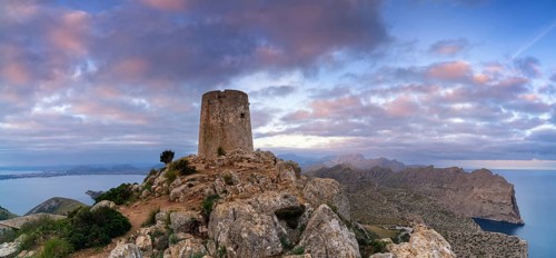 A view of the Albercutx watchtower at Cap de Formentor in northwestern Mallorca at sunrise
