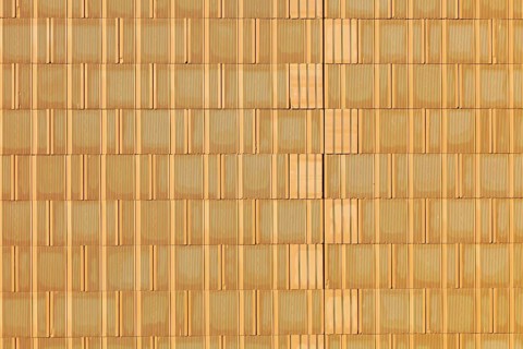 A new brick wall at a building shell house on a construction site. Background. Austria
