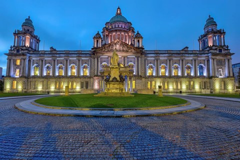 The illuminated Belfast City Hall at dawn