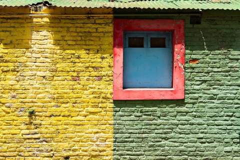 Colourful wall with windows in the La Boca district, Buenos Aires Argentina