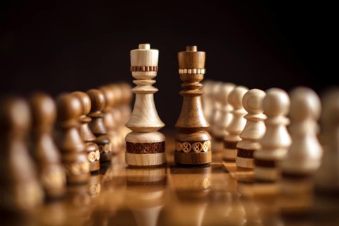 Chess on a dark background. A puzzle game with tricky combinations that requires planning and