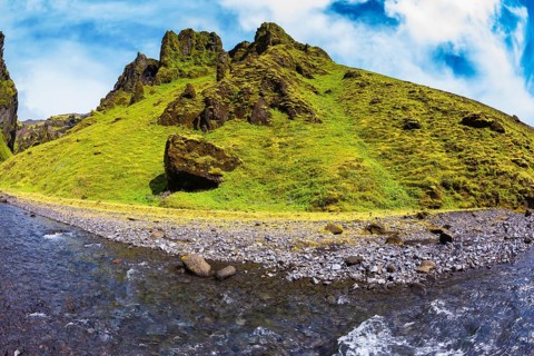 Scenic summer Iceland. The canyon Pakgil fast flowing shallow stream. The photo was taken Fisheye