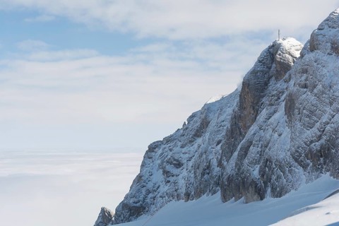 Mountain in the Dachstein region above a blanket of fog