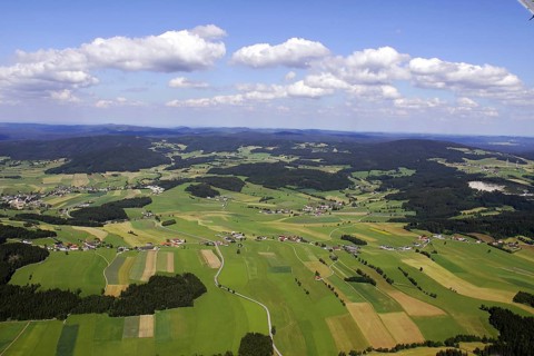 Landscape shot from an aeroplane. Meadows, fields and farmland Austria