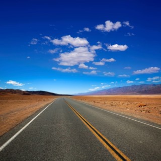 Deserted Route 190 highway in heart of Death Valley California
