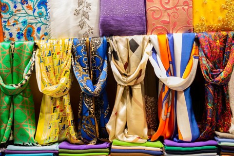 Pile of bright Multi-colored pieces of fabric in a bazaar