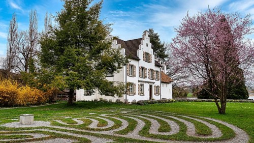 View of the priest's house on the island of Werd with the labyrinth in the foreground