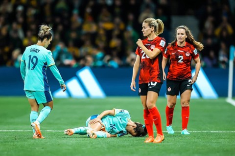 MELBOURNE, AUSTRALIA, JULY 31: Hayley RASO of Australia goes down injured as Australia plays Canada