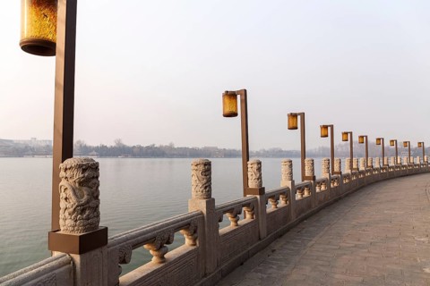 Lamps along a lakeside promenade in Beihai Park, Beijing, China in March 2018, Beijing, China, Asia