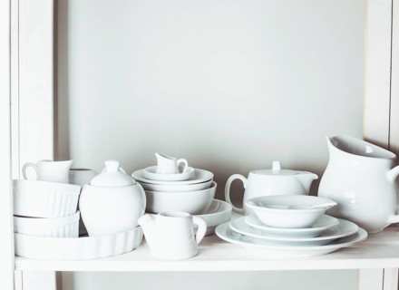 Shelves in the rack in the kitchen at shabby chic style