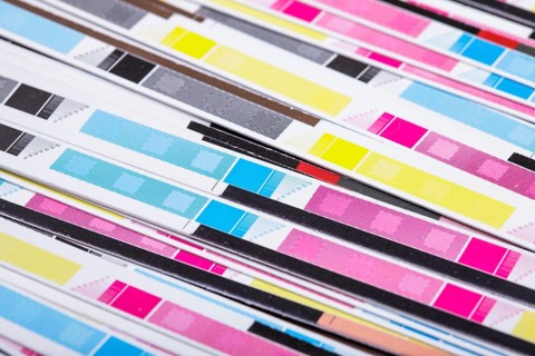 CMYK color on printed sheets of paper after cutting