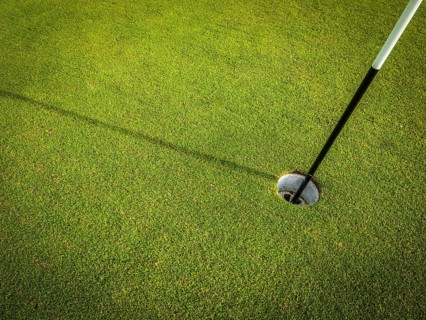 Detail Of A Hole On A Golf Course With Pole And Copy Space