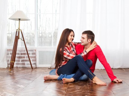 Couple in love at home relaxing on the floor
