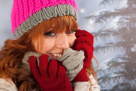 Portrait of woman in winter with snow