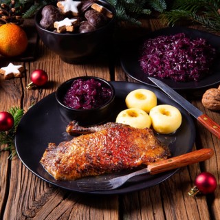 Roast goose with baked apples, red cabbage and dumplings