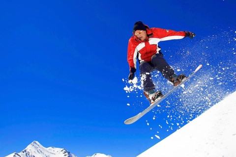 Skiers in action, descent on a slope, deep snow