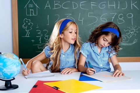 Classroom with two kids students cheating on test exam at school