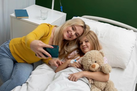A heartwarming selfie captures a loving mother and daughter sharing a joyful moment in a hopeful