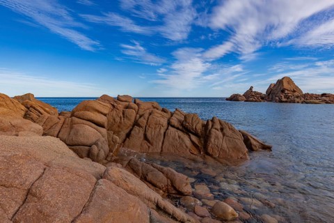 Coastal landscape with bizarre red rocks and sea view, Spiaggia di Cala E'Luas, Ogliastra,