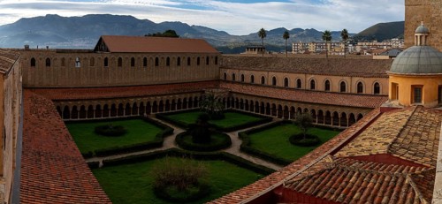 Monreale, Italy, 5 January, 2024: panorama view of the cloister and inner courtyard of the Monreale