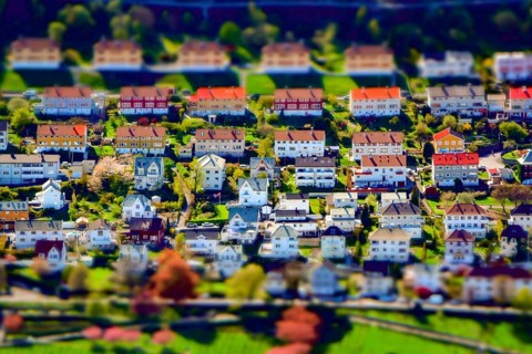 Tilt-shift creative image of an upper-class residential city suburb district with houses and