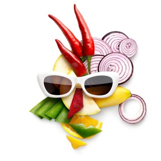 Quirky food concept of cubist style female face in sunglasses made of fruit and vegetables, on