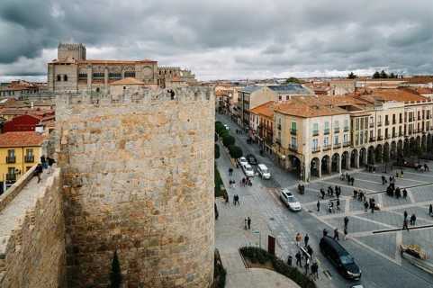 Avila, Spain, November 11, 2014: Cityscape of Avila from Medieval Walls a cloudy day. The old city