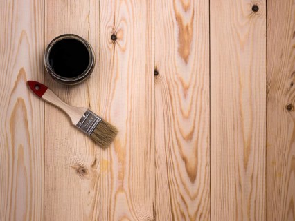Stain and brush on wooden backdrop