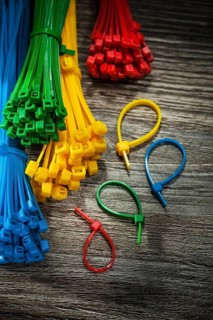 Collection of plastic cables on vintage wooden board
