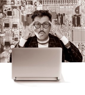 Nerd pensive man with myopic glasses looking for solution on electronics technology problem