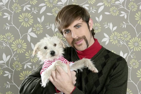 Geek retro man holding dog silly couple on wallpaper