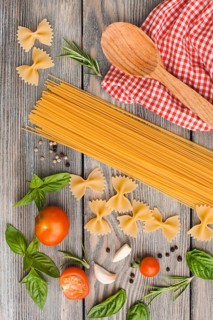 Raw Italian pasta with tomato sauce ingredients
