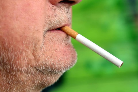 Man with a cigarette in his mouth