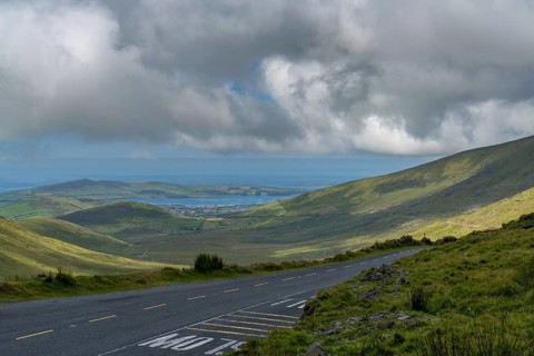 The steep and winding mountain road leading to the top of Connor Pass on the Dingle Peninsula