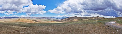 Panorama of Mongolian landscape with road and mountains