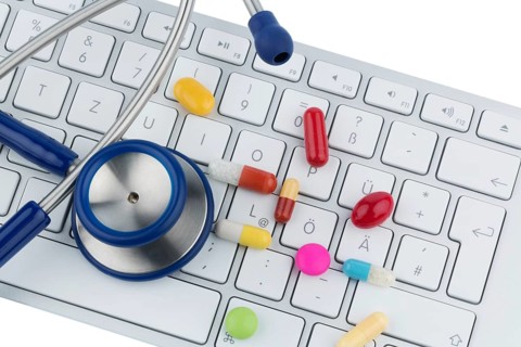 Tablets on keyboard, symbol photo for online pharmacies and drug costs Austria