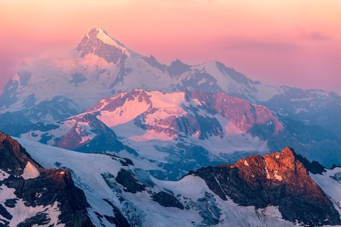 Colorful pink sunrise in mountains. Caucasus, Russia, Europe