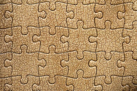 Background of cracked oil paint from a jigsaw