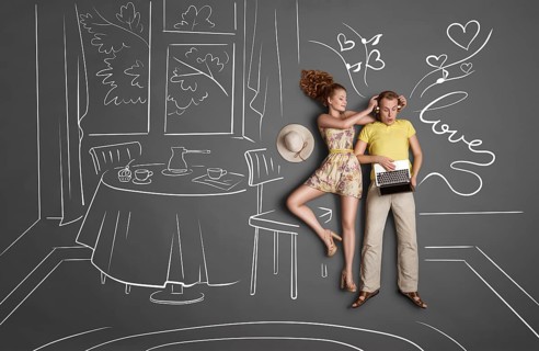 Love story concept of a romantic couple against chalk drawings background. Male listening to music