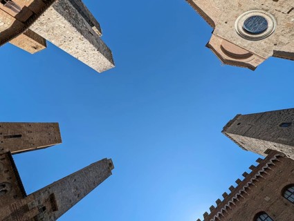 Wide angle sky view at the Piazza del Duomo in San Gimignano, Italy, Europe