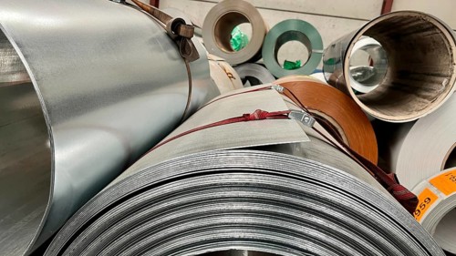 Rolls of galvanized steel sheet inside the factory or warehouse
