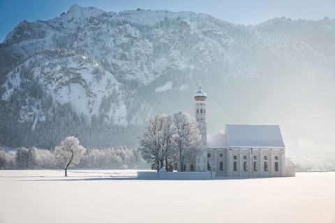 St. Coloman with trees in wintery landscape, Alps, Germany, Europe