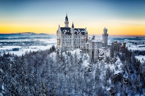 Neuschwanstein Castle at sunset in winter landscape. Germany