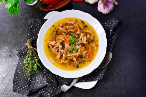Traditional Politur-style tripe soup with beef and vegetables