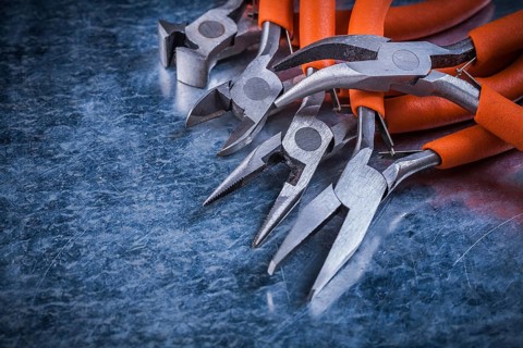 Sharp insulated electric pliers nippers horizontal version electricity concept