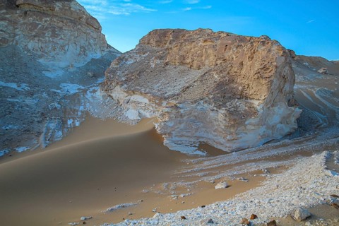 Late afternoon sun casting shadows on rocks in the Libyan desert white desert, Farafra, Egypt,