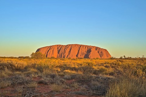 Ayers Rock or Uluru respectively at sun set. Photo shot in 2020