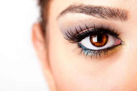 Fashion beautiful female brown watchful eye with long black eyelashes mascara, isolated, New York,